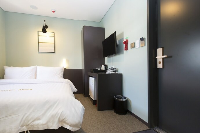 Imagen de la habitación del Hotel Grid Inn. Foto 23