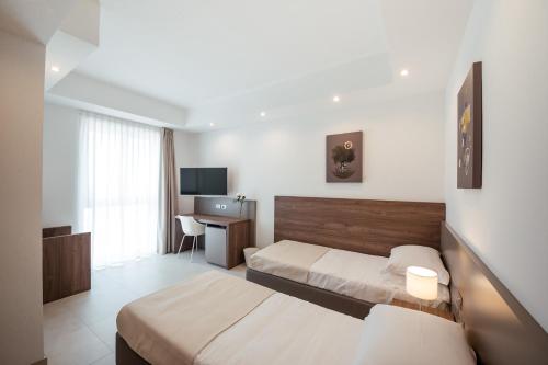 Imagen de la habitación del Hotel Grieco Business & Spa. Foto 9