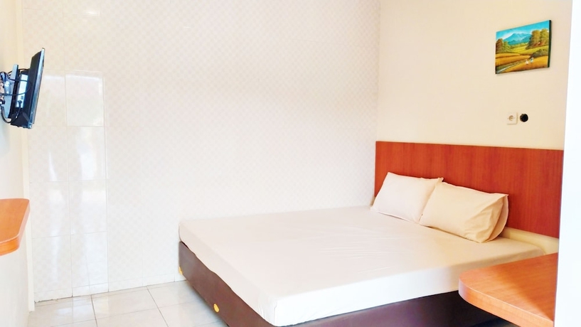Imagen de la habitación del Hotel Griya Alisha. Foto 12