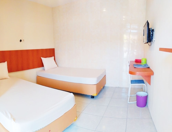 Imagen de la habitación del Hotel Griya Alisha. Foto 14