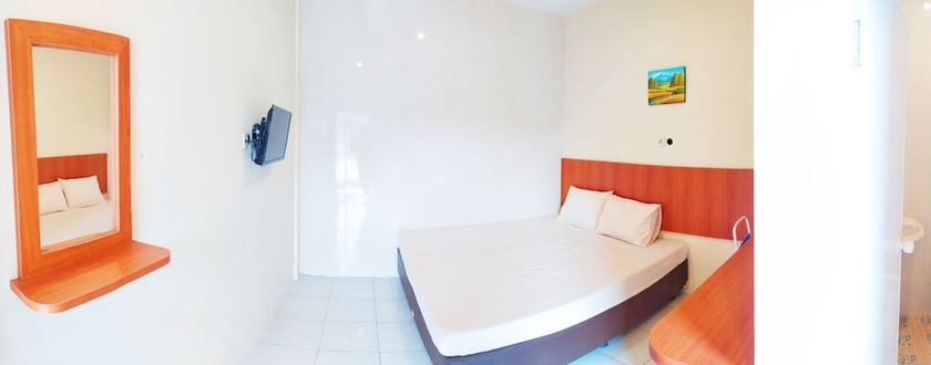 Imagen de la habitación del Hotel Griya Alisha. Foto 15
