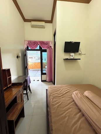 Imagen de la habitación del Hotel Griya Helin. Foto 2