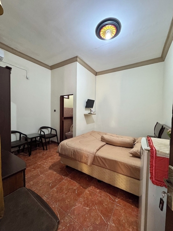 Imagen de la habitación del Hotel Griya Helin. Foto 12