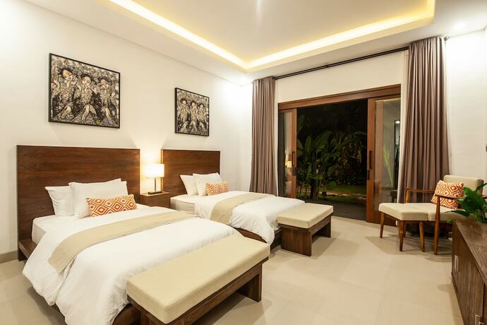 Imagen de la habitación del Hotel Griya Shanti Suites. Foto 16
