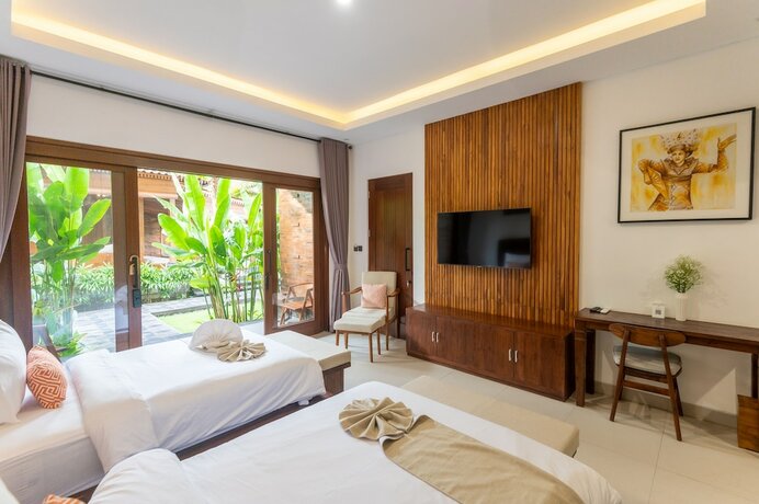 Imagen de la habitación del Hotel Griya Shanti Suites. Foto 18