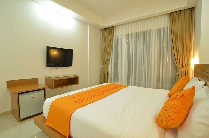 Imagen de la habitación del Hotel Griya Sunset Kuta. Foto 11