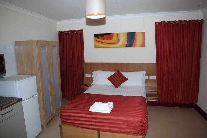 Imagen de la habitación del Hotel Grove Apartments. Foto 2