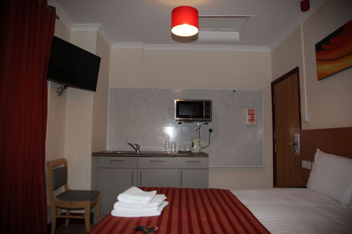 Imagen de la habitación del Hotel Grove Apartments. Foto 3