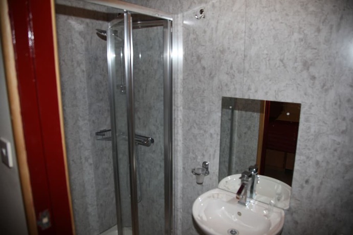 Imagen de la habitación del Hotel Grove Apartments. Foto 5