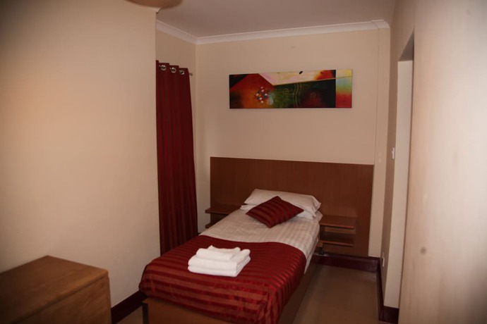 Imagen de la habitación del Hotel Grove Apartments. Foto 6