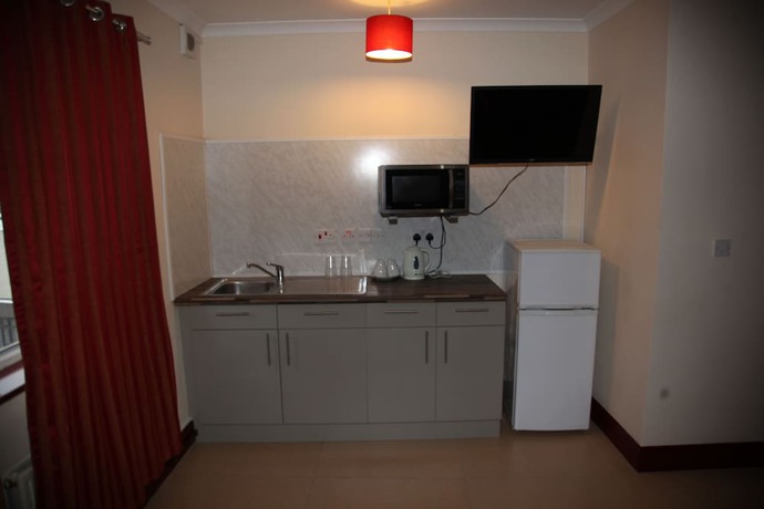 Imagen de la habitación del Hotel Grove Apartments. Foto 8