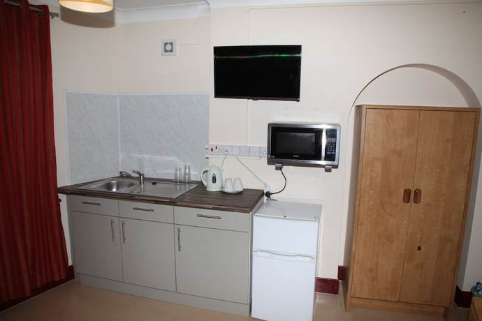 Imagen de la habitación del Hotel Grove Apartments. Foto 11