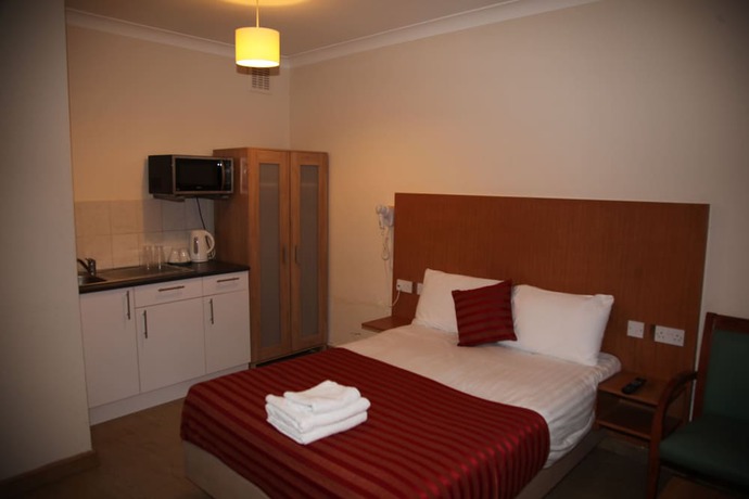 Imagen de la habitación del Hotel Grove Apartments. Foto 12