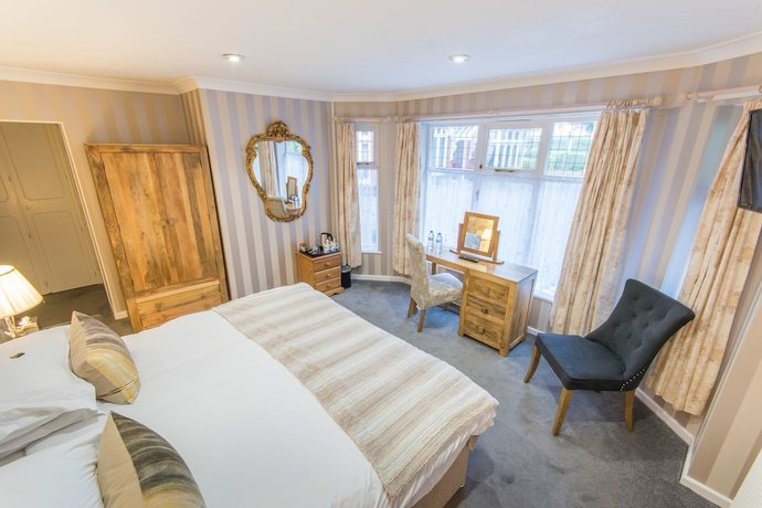 Imagen de la habitación del Hotel Grovefield Manor. Foto 6