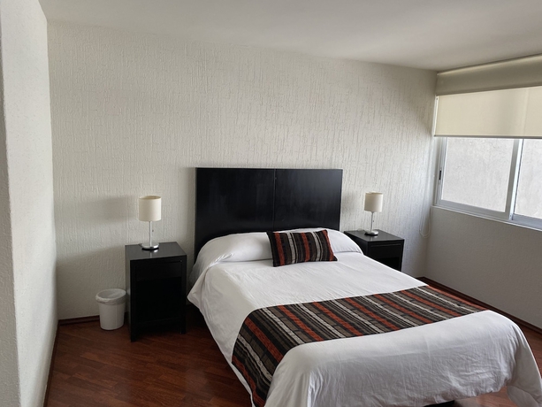 Imagen de la habitación del Hotel Grupo Kings Suites Chimborazo. Foto 4