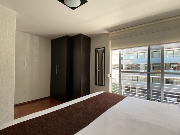 Imagen de la habitación del Hotel Grupo Kings Suites Chimborazo. Foto 5