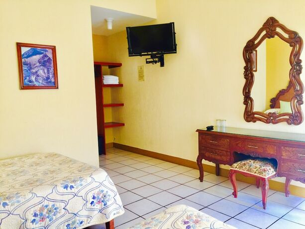 Imagen de la habitación del Hotel Guam&uacute;chil Parque Acu&aacute;tico and Caba&ntilde;as. Foto 17