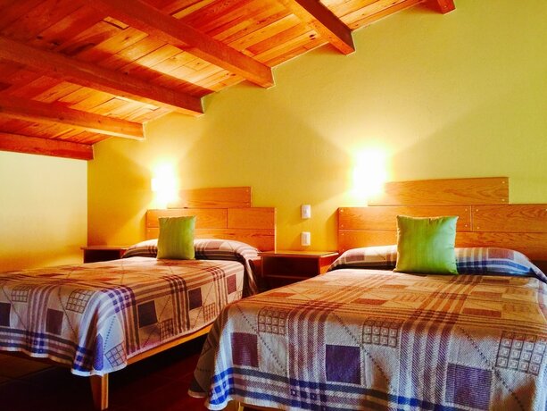 Imagen de la habitación del Hotel Guam&uacute;chil Parque Acu&aacute;tico and Caba&ntilde;as. Foto 19