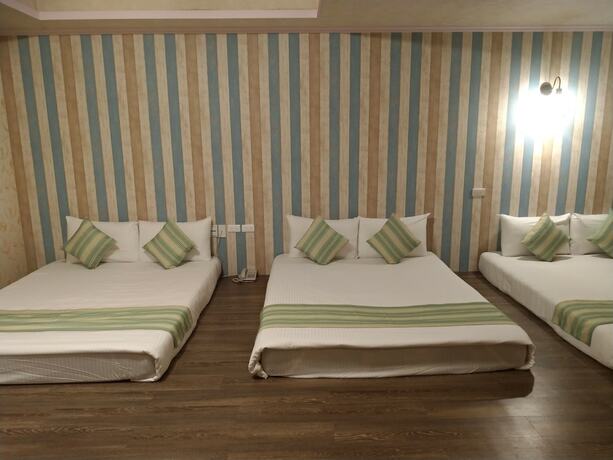 Imagen de la habitación del Hotel Guan Lun. Foto 17