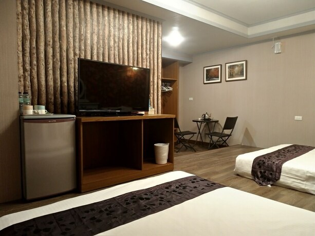 Imagen de la habitación del Hotel Guan Lun. Foto 33