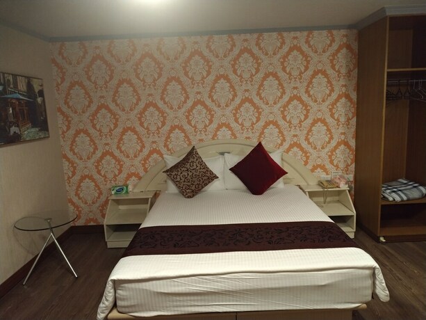 Imagen de la habitación del Hotel Guan Lun. Foto 34