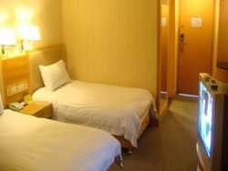 Imagen de la habitación del Hotel Guang Dong. Foto 4