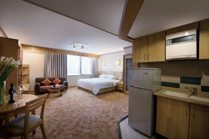Imagen de la habitación del Hotel Guangdong Zhuhai. Foto 8