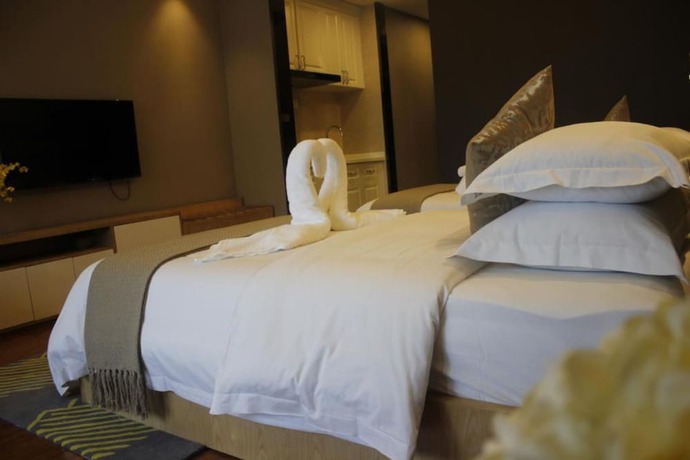 Imagen de la habitación del Hotel Guangzhou Ahotel Service Apartment. Foto 11