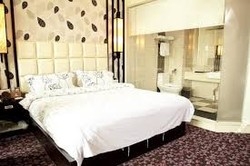 Imagen de la habitación del Hotel Guangzhou Aoyuan Health City Hotel. Foto 4