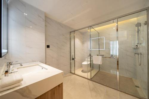 Imagen de la habitación del Hotel Guangzhou Baiyun Airport COCO. Foto 17