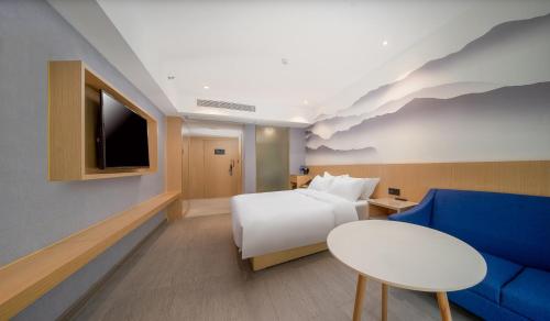 Imagen de la habitación del Hotel Guangzhou Baiyun Airport COCO. Foto 18