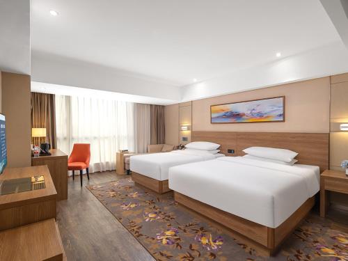 Imagen de la habitación del Hotel Guangzhou Baiyun Airport Renhe Cornet International Chain. Foto 19