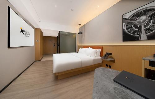 Imagen de la habitación del Hotel Guangzhou Baiyun Airport Rezen Select. Foto 15
