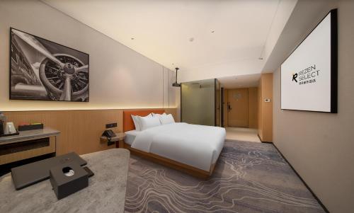 Imagen de la habitación del Hotel Guangzhou Baiyun Airport Rezen Select. Foto 17