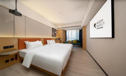 Imagen de la habitación del Hotel Guangzhou Baiyun Airport Rezen Select. Foto 18