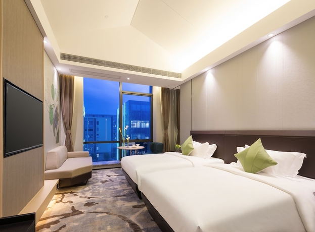 Imagen de la habitación del Hotel Guangzhou Buddy. Foto 11