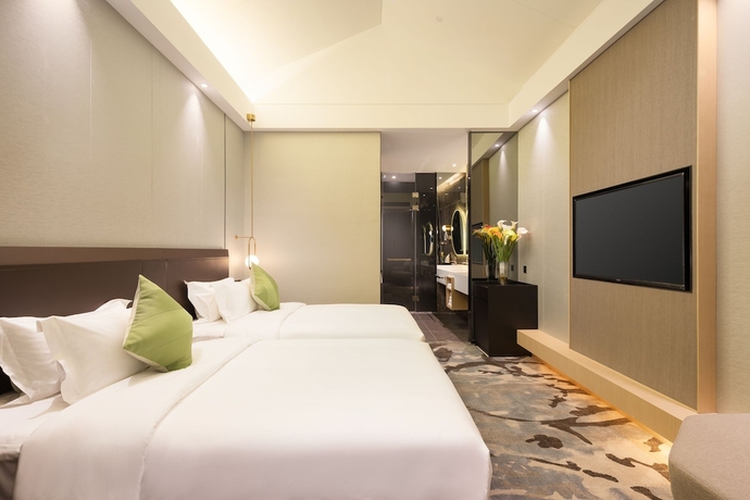 Imagen de la habitación del Hotel Guangzhou Buddy. Foto 12