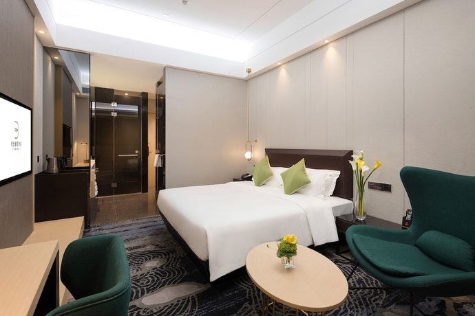 Imagen de la habitación del Hotel Guangzhou Buddy. Foto 14