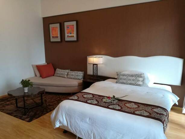 Imagen de la habitación del Hotel Guangzhou Chanson Apartment. Foto 18
