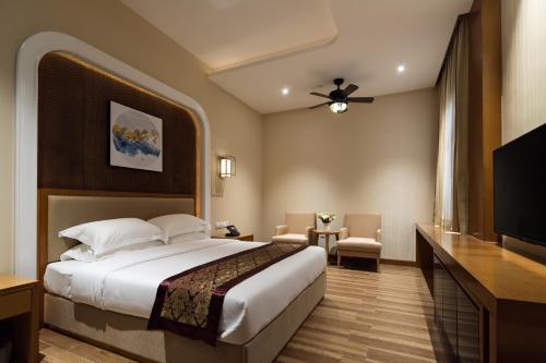 Imagen de la habitación del Hotel Guangzhou Cheermore Recreation Hotel. Foto 8
