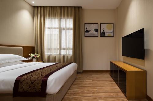 Imagen de la habitación del Hotel Guangzhou Cheermore Recreation Hotel. Foto 9