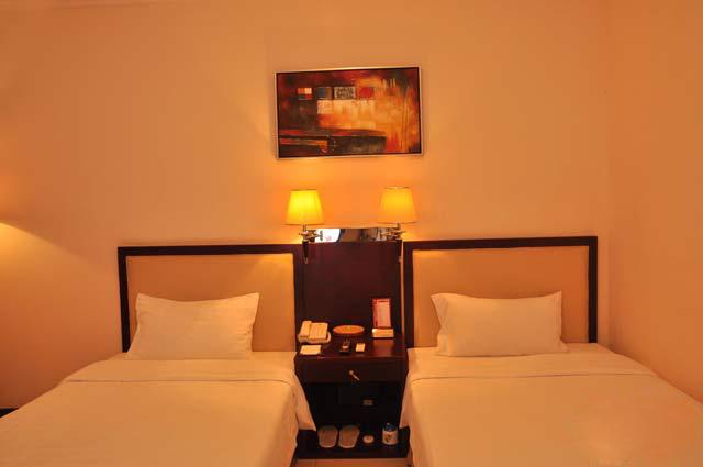 Imagen de la habitación del Hotel Guangzhou Dagang Garden. Foto 5