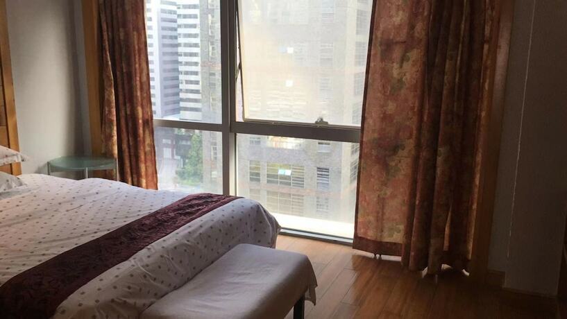 Imagen de la habitación del Hotel Guangzhou Damei Apartment. Foto 20