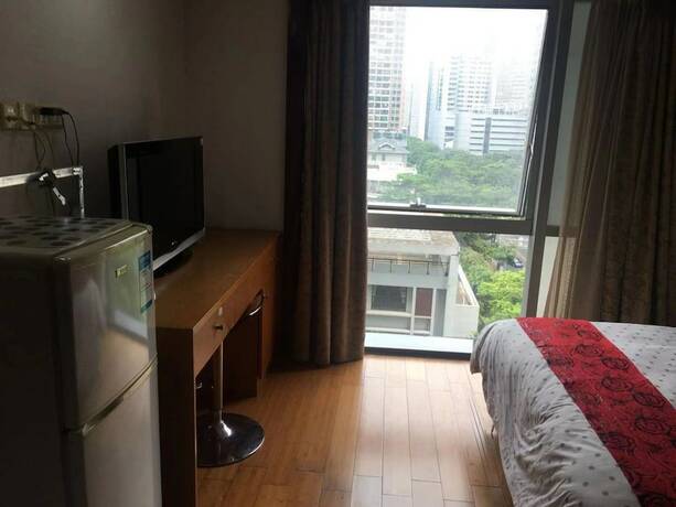 Imagen de la habitación del Hotel Guangzhou Damei Apartment. Foto 21