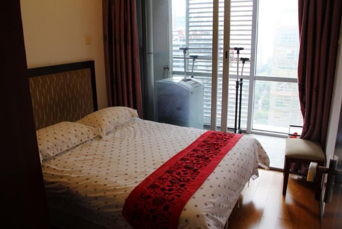 Imagen de la habitación del Hotel Guangzhou Damei Apartment. Foto 22