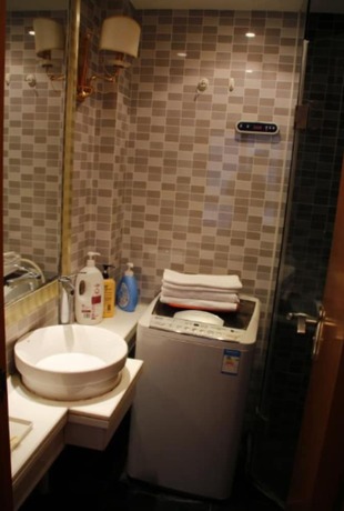 Imagen de la habitación del Hotel Guangzhou Damei Apartment. Foto 24