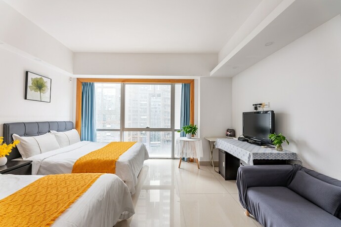 Imagen de la habitación del Hotel Guangzhou Damei Apartment. Foto 25