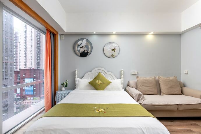 Imagen de la habitación del Hotel Guangzhou Damei Apartment. Foto 27