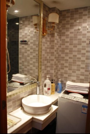 Imagen de la habitación del Hotel Guangzhou Damei Apartment. Foto 31