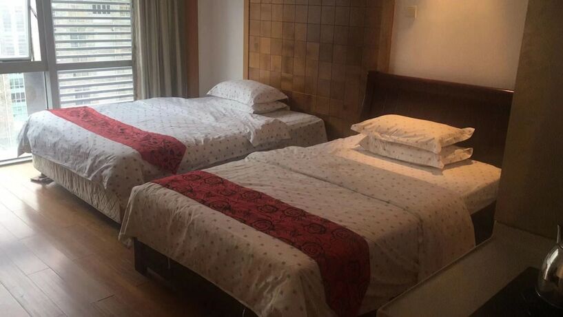 Imagen de la habitación del Hotel Guangzhou Damei Apartment. Foto 32